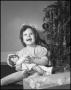Photograph: [Young girl holding a doll]