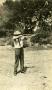Photograph: [Photograph of a man pointing a rifle]