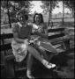 Photograph: [Two women sitting on a bench]