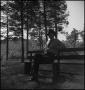 Photograph: [Man relaxing on a bench]
