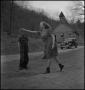 Photograph: [Student and teacher playing horseshoes(1)]