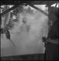 Photograph: [Dollie Ellison stirring in the steam]