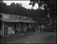 Photograph: [Outside of a general store, 2]