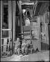 Photograph: [Two toddlers in a mill]