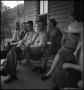 Photograph: [Family laughing on a porch, 2]