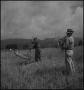 Thumbnail image of item number 1 in: '[Two farmers harvesting wheat]'.