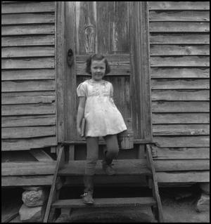 Primary view of object titled '[Girl on the school steps]'.