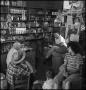 Photograph: [Man speaking in a store, 2]