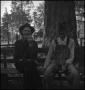 Photograph: [Two men sitting on a bench]