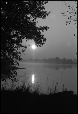 Primary view of object titled '[The sun setting over a lake, 14]'.