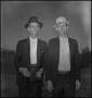 Photograph: [Two men with a bible]
