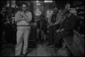 Photograph: [Photograph of a group of men in a general store, 1]