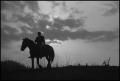 Photograph: [Silhouette of a man riding a horse, 2]