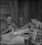 Photograph: [A man and woman eating together]