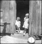 Photograph: [Girls in the school house doorway]