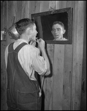 Primary view of object titled '[Gilbert Dove shaves for his wedding]'.