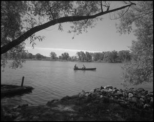 Primary view of object titled '[Two men in a canoe]'.
