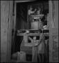 Photograph: [Two individuals working the mill]