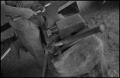 Photograph: [Blurred photograph of a smithing workshop]