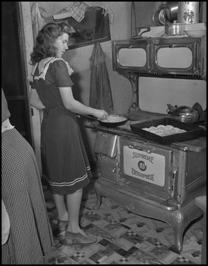 Primary view of object titled '[Hazel Petrey cooking breakfast on her wedding day]'.