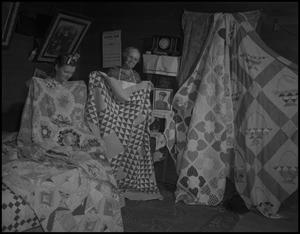 Primary view of object titled '[Aunt Nora Treece showing quilts]'.