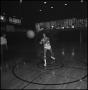 Photograph: [Basketball player throwing ball]