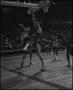 Photograph: [Basketball Player Blocking His Opponent]