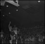 Photograph: [NTSU basketball player goes to shoot the ball]