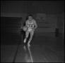 Photograph: [Ron Miller dribbling a basketball]