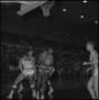 Photograph: [St. Louis basketball player holds the ball]
