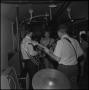 Photograph: [Students playing instruments in train car]