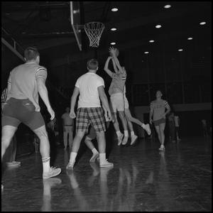 Primary view of object titled '[Basketball player jumps to shoot the ball]'.