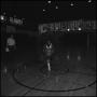 Photograph: [Basketball player running along the court]