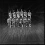 Photograph: [NTSU basketball team poses in a gymnasium]