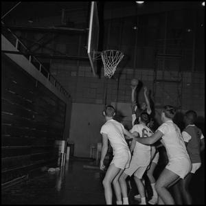 Primary view of object titled '[Basketball player jumping to shoot a basket, 2]'.