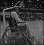 Primary view of [Man sitting in wheelchair at basketball tournament]