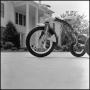 Photograph: [Tricycle in front of the President's House]