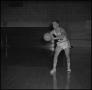 Photograph: [Ron Miller holding a basketball]