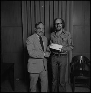 Primary view of object titled '[President Nolen presents an award]'.