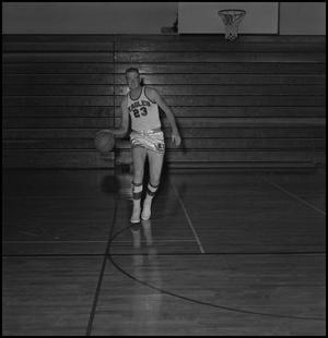 Primary view of object titled '[Wayne Hopkins dribbling a basketball]'.