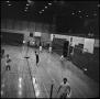 Photograph: [Men playing badminton in a gym, 2]