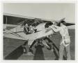 Photograph: [World War II student pilots and their plane]