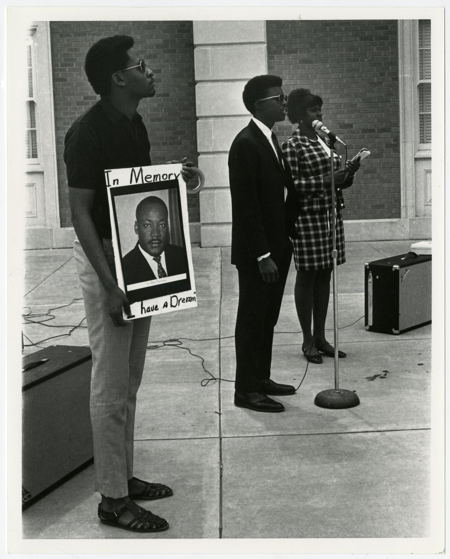 NTSU students demonstrate at a memorial ceremony for Dr. Martin Luther King, Jr.
                                                
                                                    [Sequence #]: 1 of 2
                                                