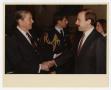 Photograph: [President Reagan shaking Charles C. Francis' hand]