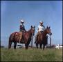 Primary view of [Buster and Sheila Welch on horseback]