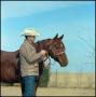 Photograph: [Matlock Rose stands near horse]