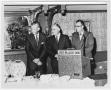 Photograph: [Rex Cauble and two men speaking at a Six Flags Inn event]