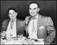 Photograph: [Rex Cauble at dinner with Lewis Cauble]
