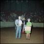 Photograph: [Man with woman holding award suitcase]