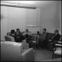 Photograph: [Teachers sitting in a lounge]